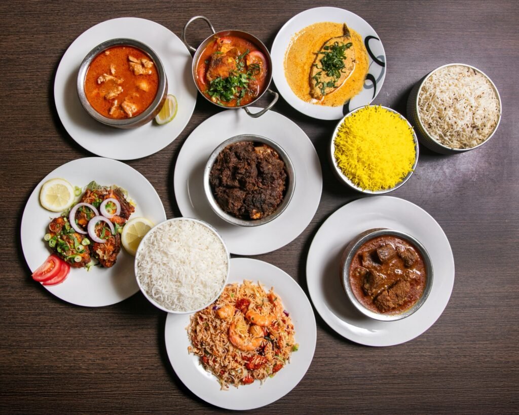 Authentic Bengali culinary spread of traditional curries, rice, and sides